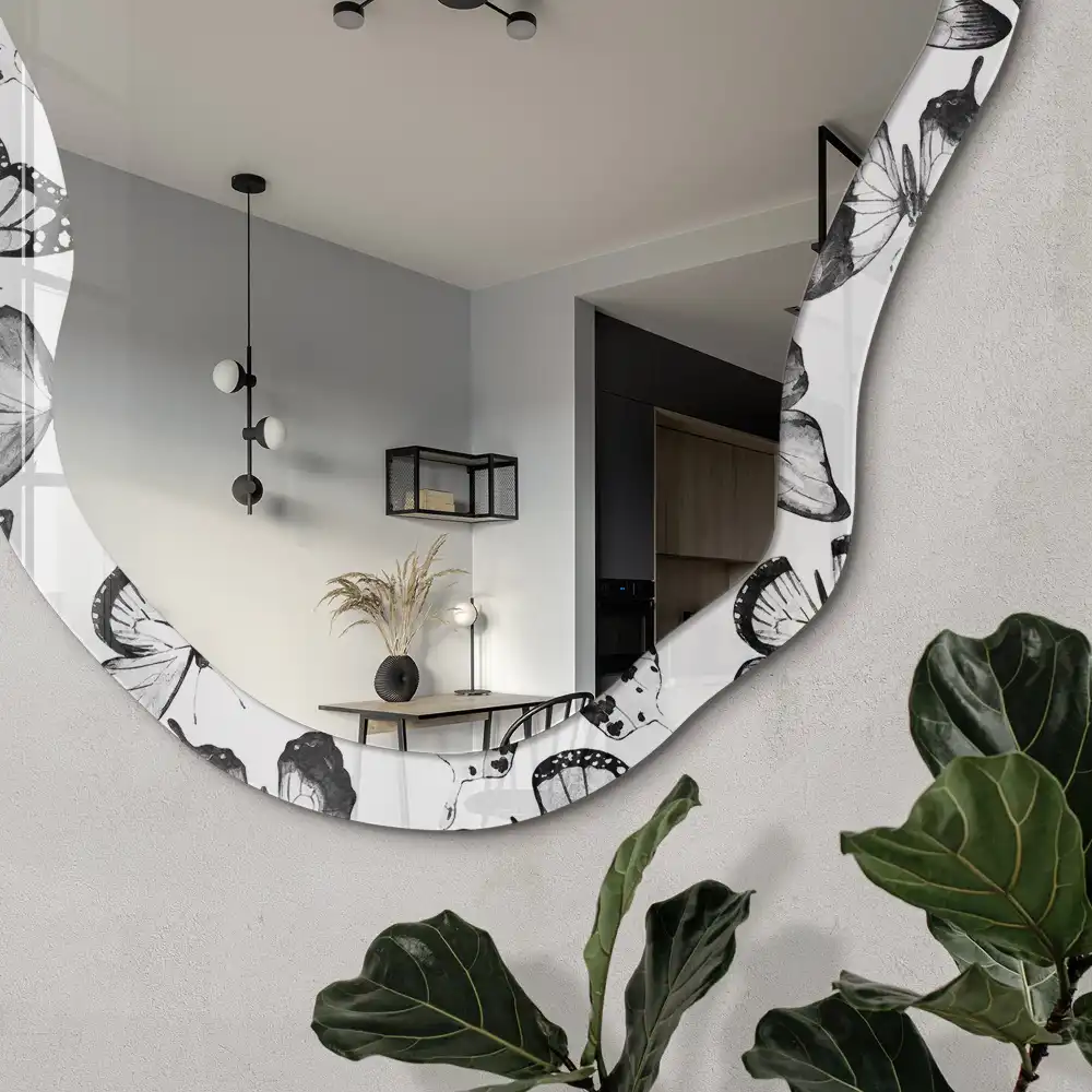 Miroir irrégulier avec impression papillons noirs