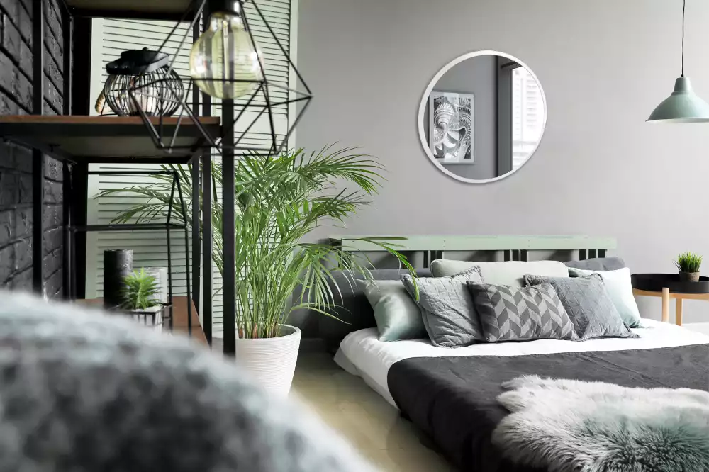 Miroir rond suspendu avec cadre blanc