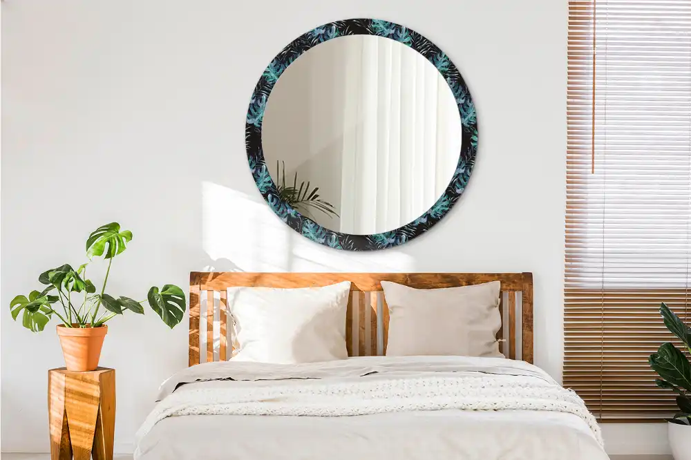 Miroir rond avec décoration feuilles exotiques