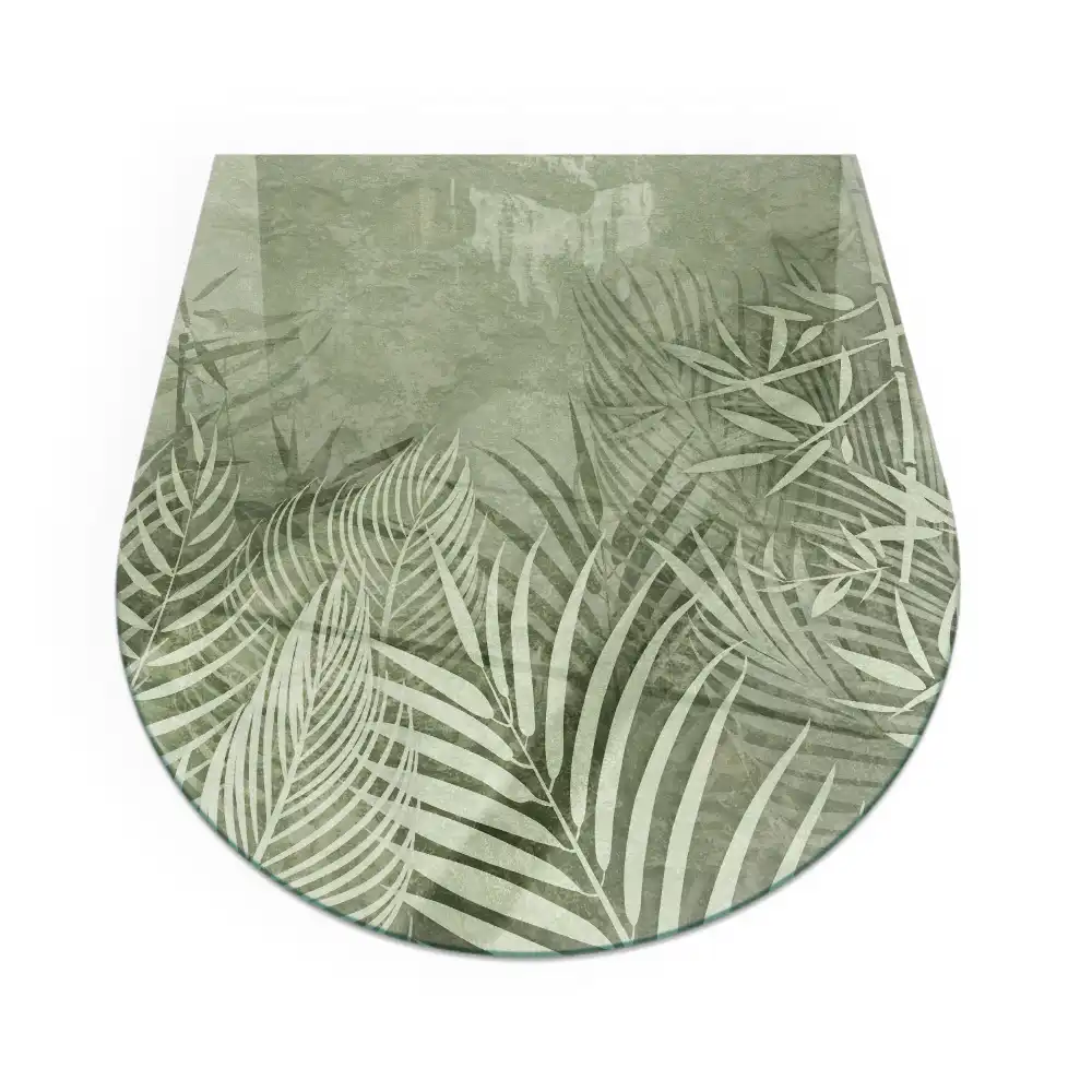Plaque de sol semi-ovale en verre trempé pour cheminée motif feuilles tropicales