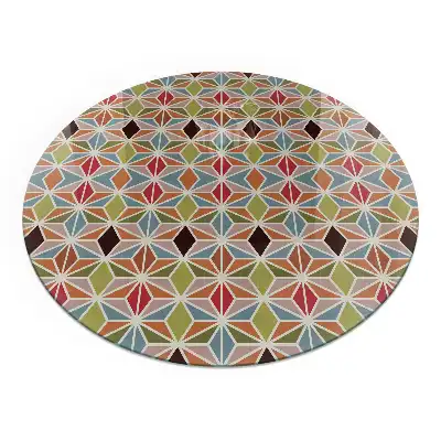 Plaque de sol ronde en verre pour cheminée avec motifs polygonaux dans une grille