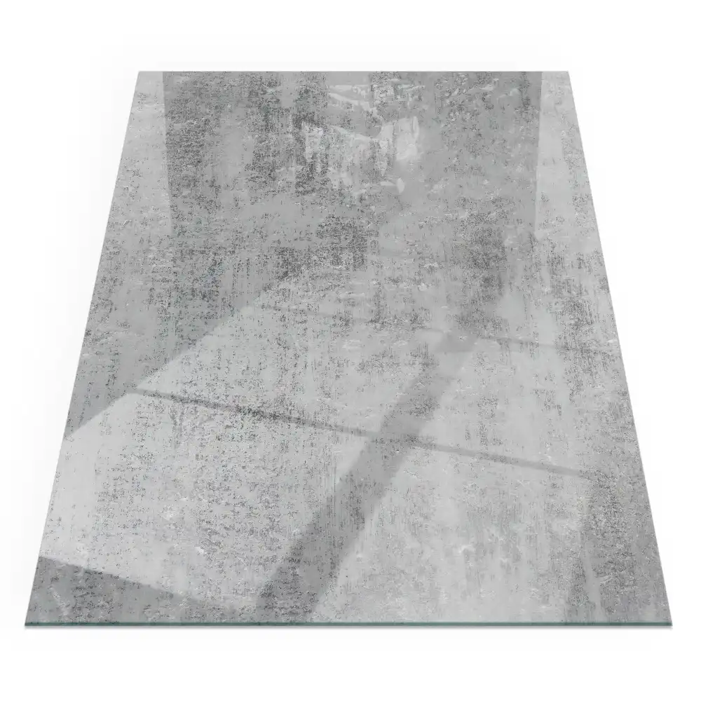 Plaque de sol rectangulaire en verre pour cheminée d'angle avec motif abstrait