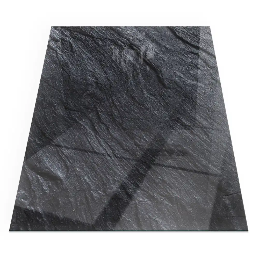 Plaque de sol rectangulaire en verre pour cheminée d'angle avec texture aspect pierre