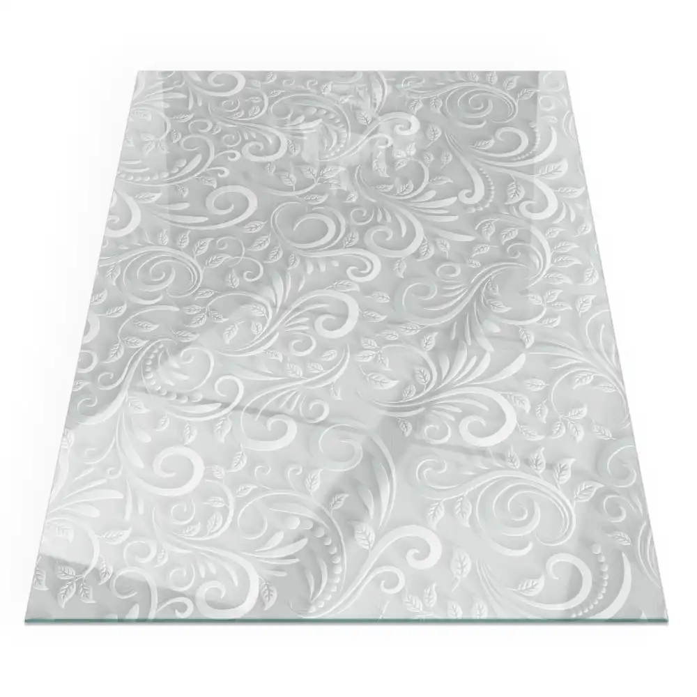 Plaque de sol rectangulaire en verre pour cheminée d'angle avec motif végétal