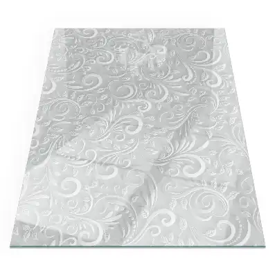Plaque de sol rectangulaire en verre pour cheminée d'angle avec motif végétal