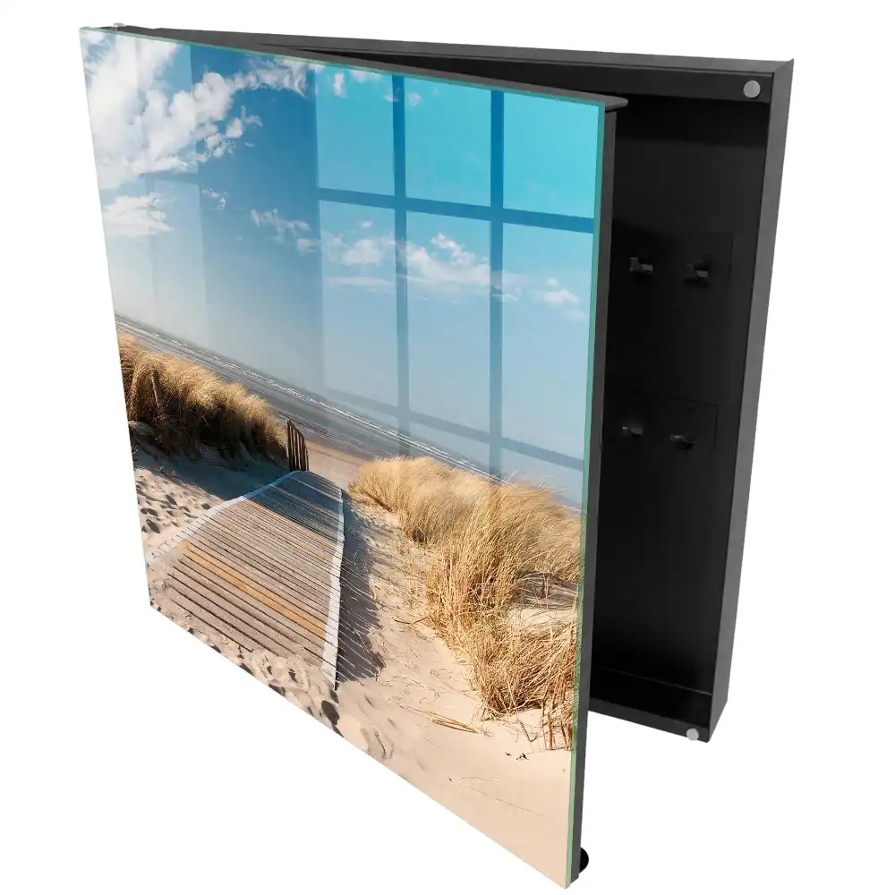 Boîte à clés un chemin sur la plage entouré de dunes et d'herbes
