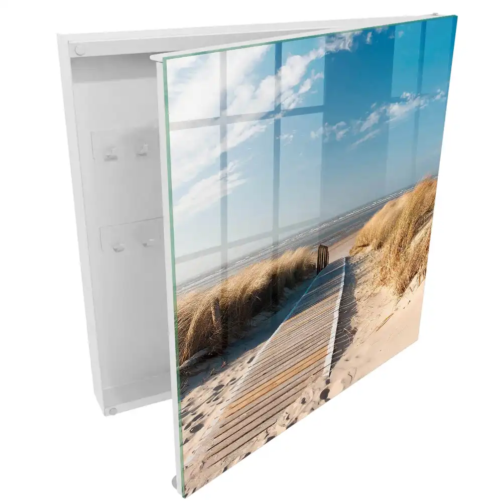 Boîte à clés un chemin sur la plage entouré de dunes et d'herbes