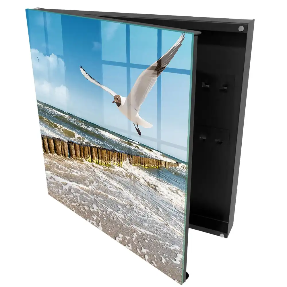 Boîte à clés murale des vagues sur la plage et une mouette