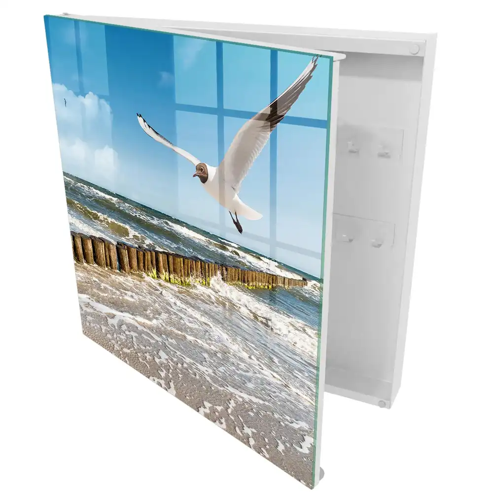 Boîte à clés murale des vagues sur la plage et une mouette