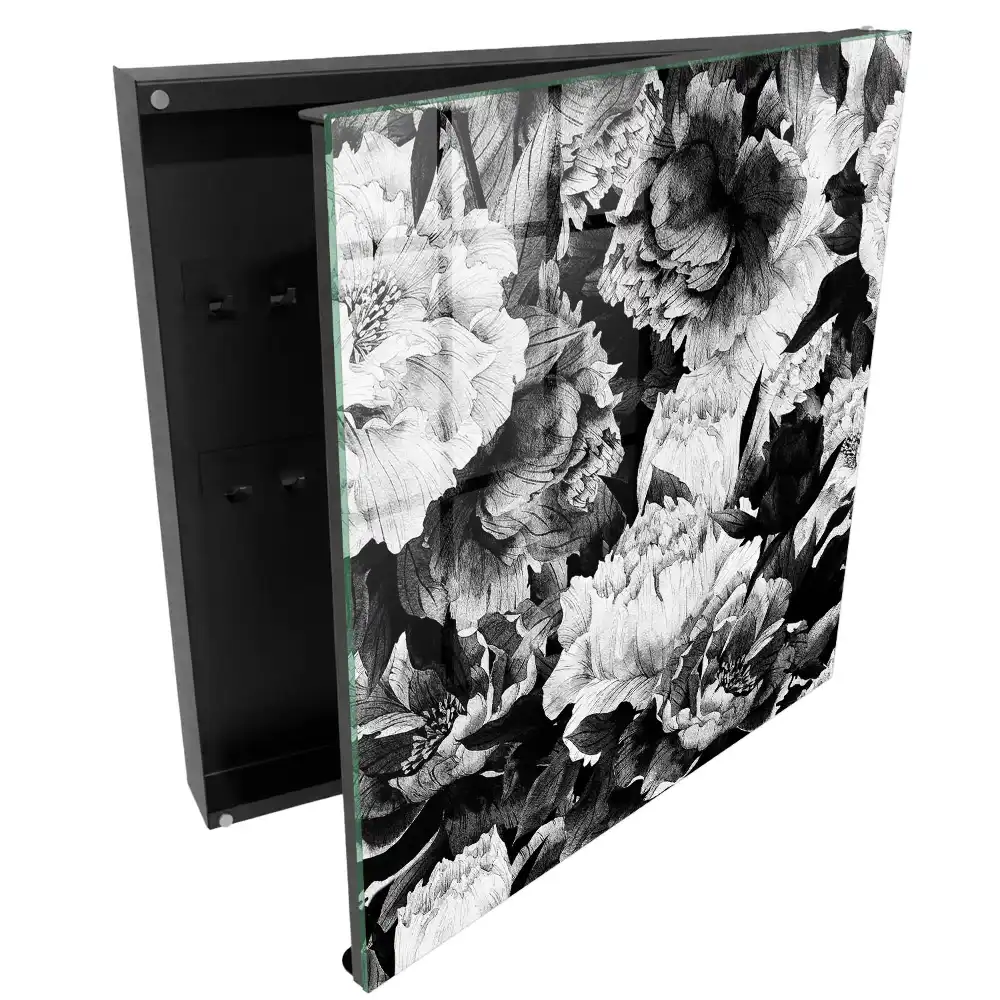 Boîte à clés des fleurs dans l'élégance du noir et blanc en harmonie.