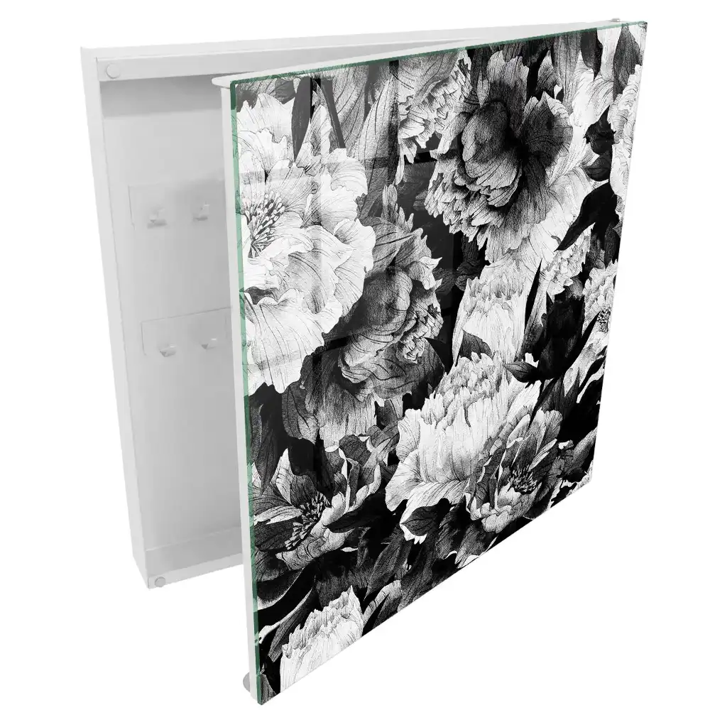 Boîte à clés des fleurs dans l'élégance du noir et blanc en harmonie.