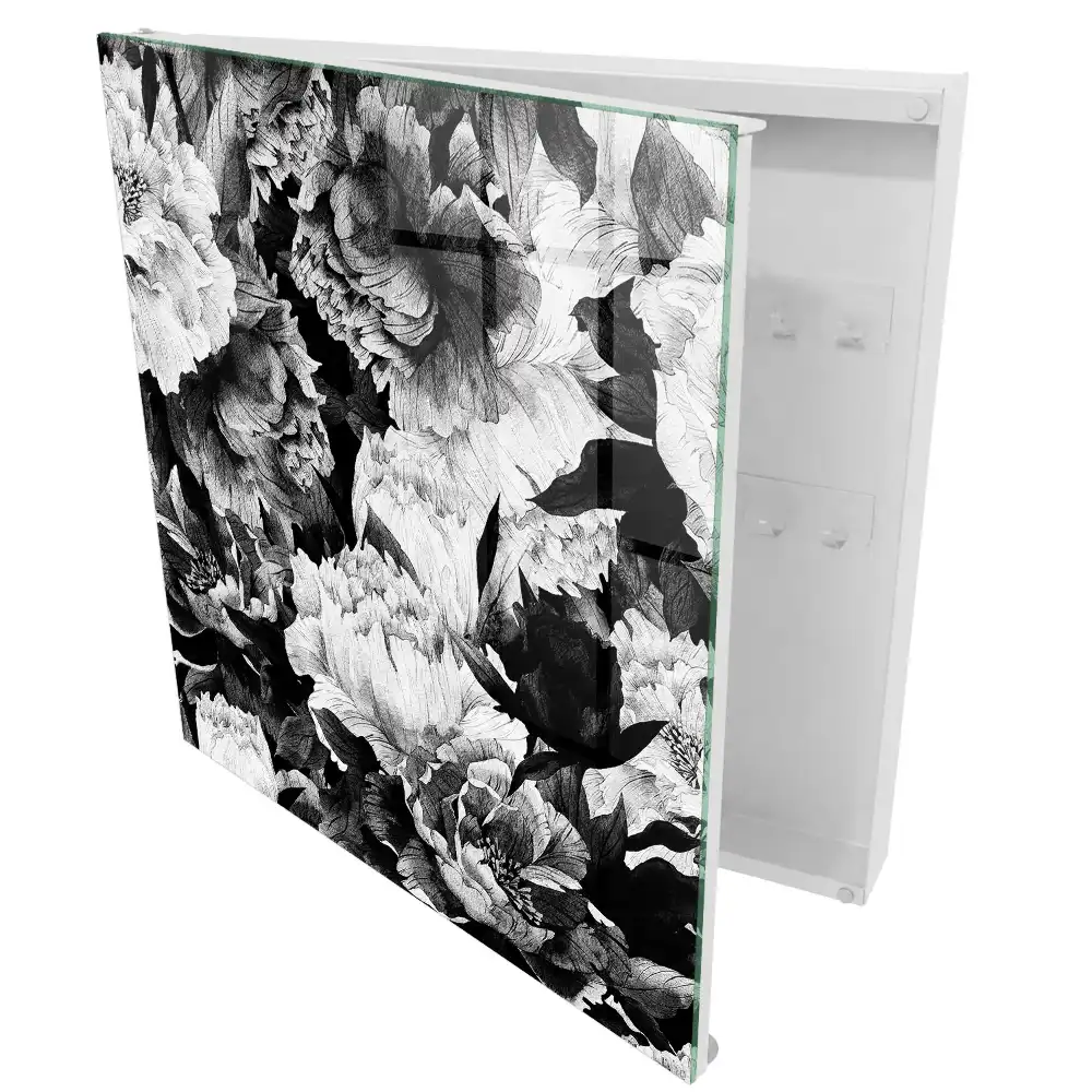 Boîte à clés des fleurs dans l'élégance du noir et blanc en harmonie.