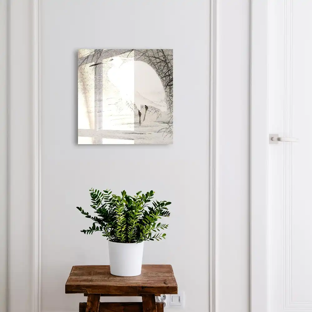 Boîte à clés un héron parmi les herbes grises
