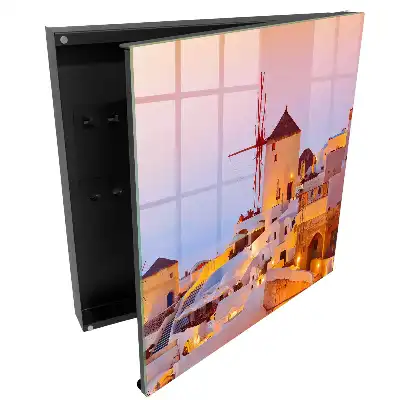 Armoire à clés bâtiments grecs et moulins à vent sous un soleil couchant chaleureux