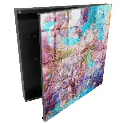 Boîte à clés murale fleurs dans des tons de violet sur fond bleu