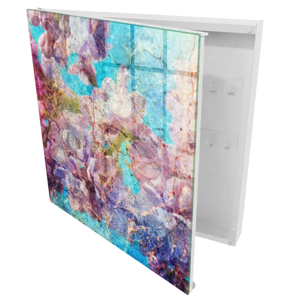 Boîte à clés murale fleurs dans des tons de violet sur fond bleu