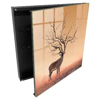 Boîte à clés un cerf magique sur fond de brouillard orangé