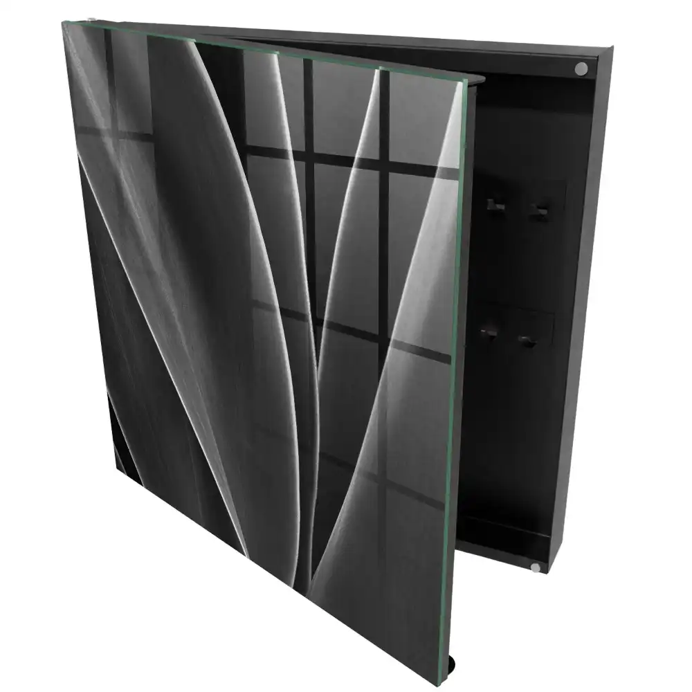 Armoire à clés feuilles noires et blanches dans une composition élégante