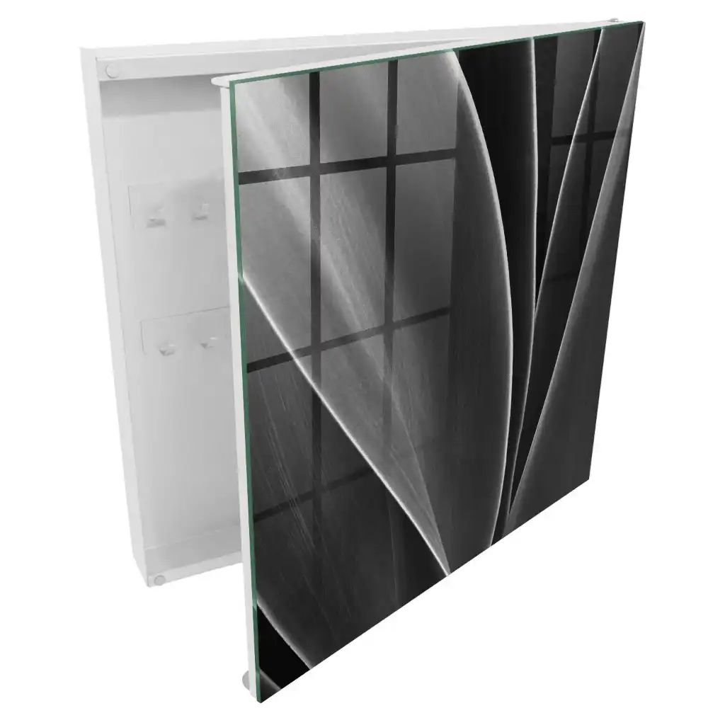 Armoire à clés feuilles noires et blanches dans une composition élégante