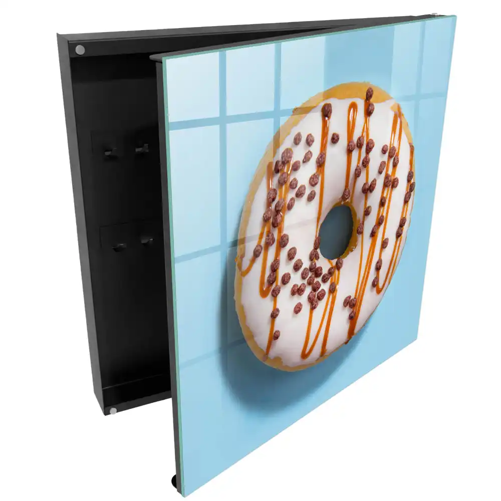 Armoire à clés beignet avec glaçage et vermicelles sur fond bleu