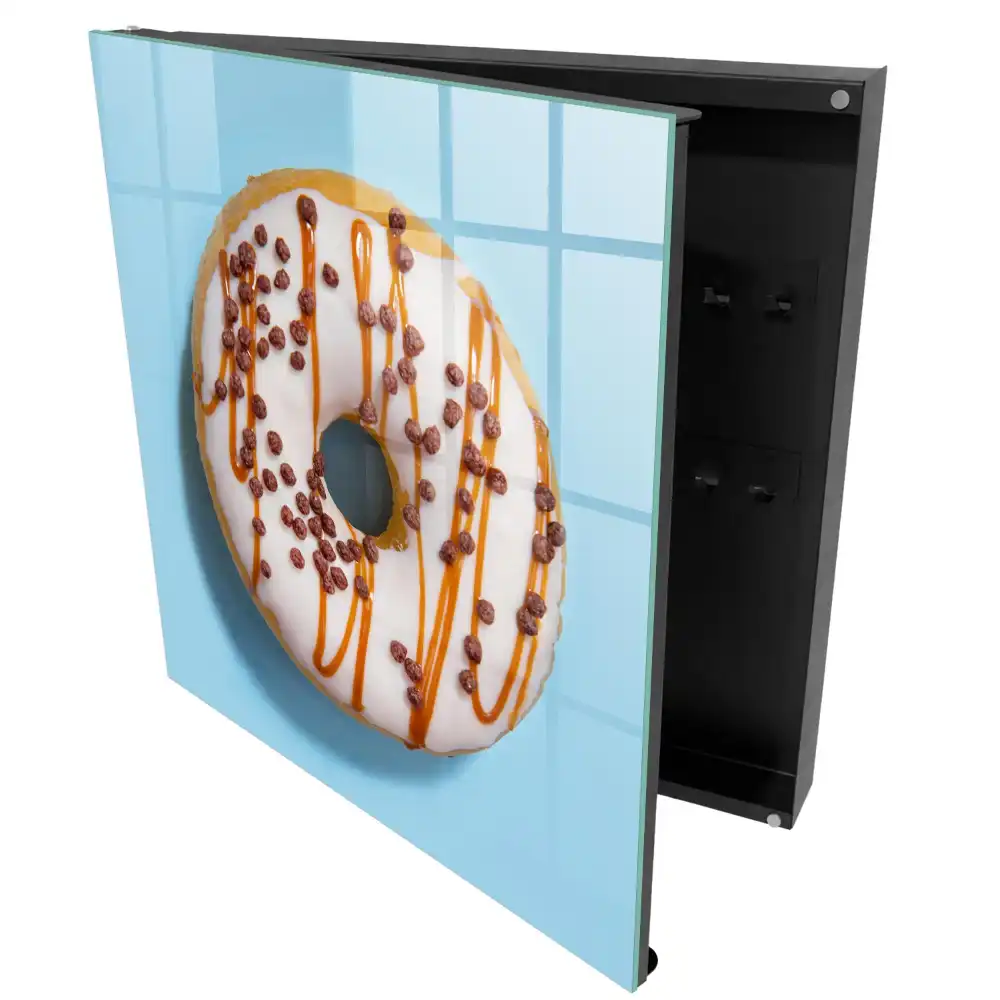 Armoire à clés beignet avec glaçage et vermicelles sur fond bleu