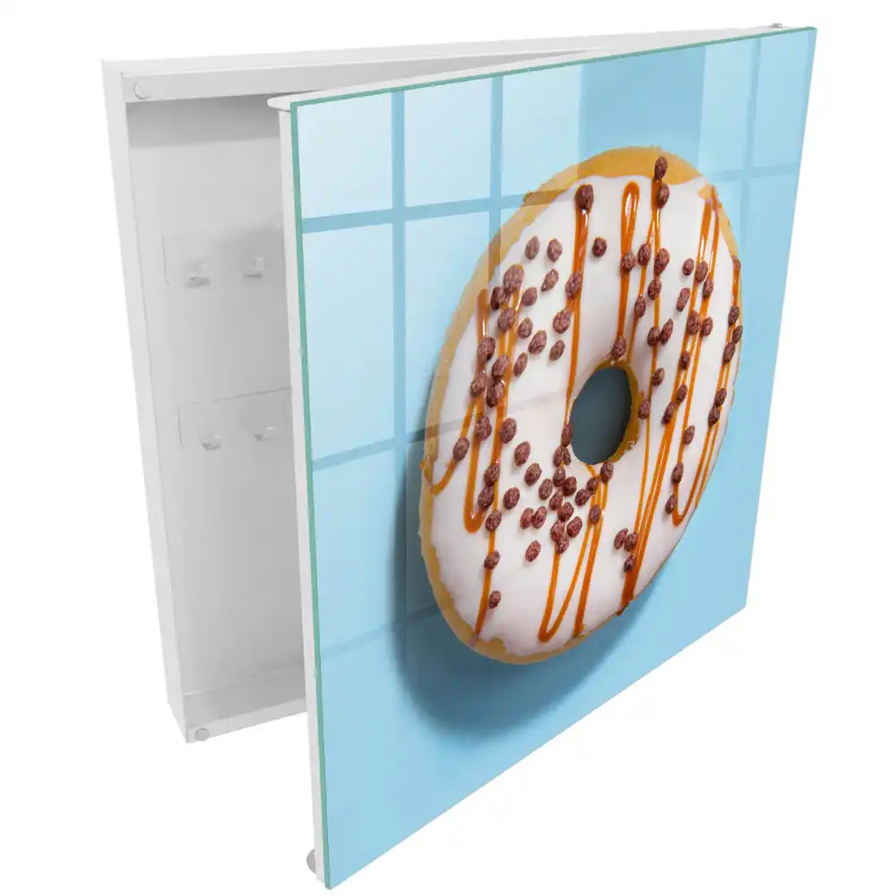 Armoire à clés beignet avec glaçage et vermicelles sur fond bleu