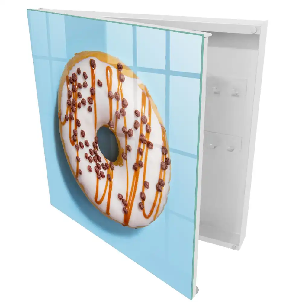 Armoire à clés beignet avec glaçage et vermicelles sur fond bleu