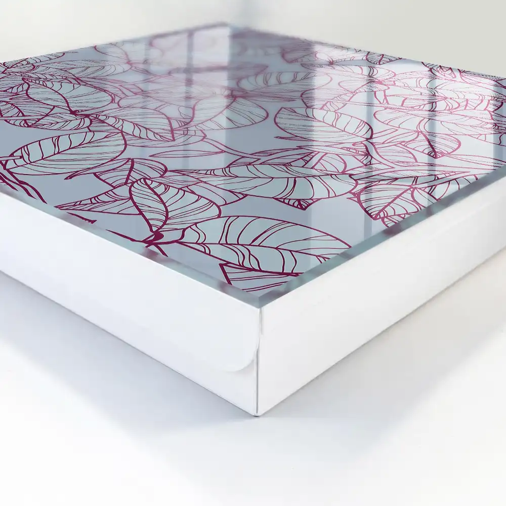 Armoire à clés motif de feuille sur fond gris avec un contour bordeaux