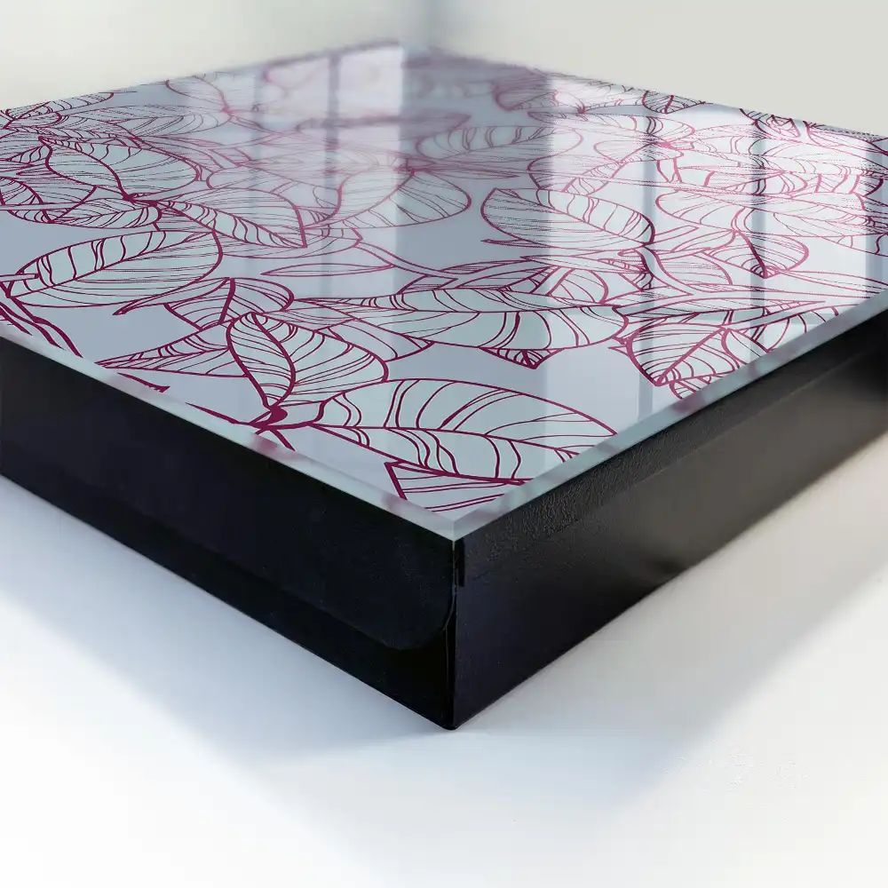 Armoire à clés motif de feuille sur fond gris avec un contour bordeaux