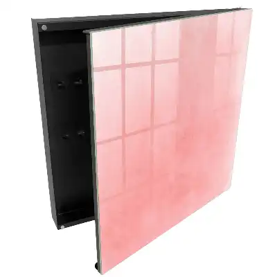 Boîte à clés murale fond rose délicat avec un motif subtil