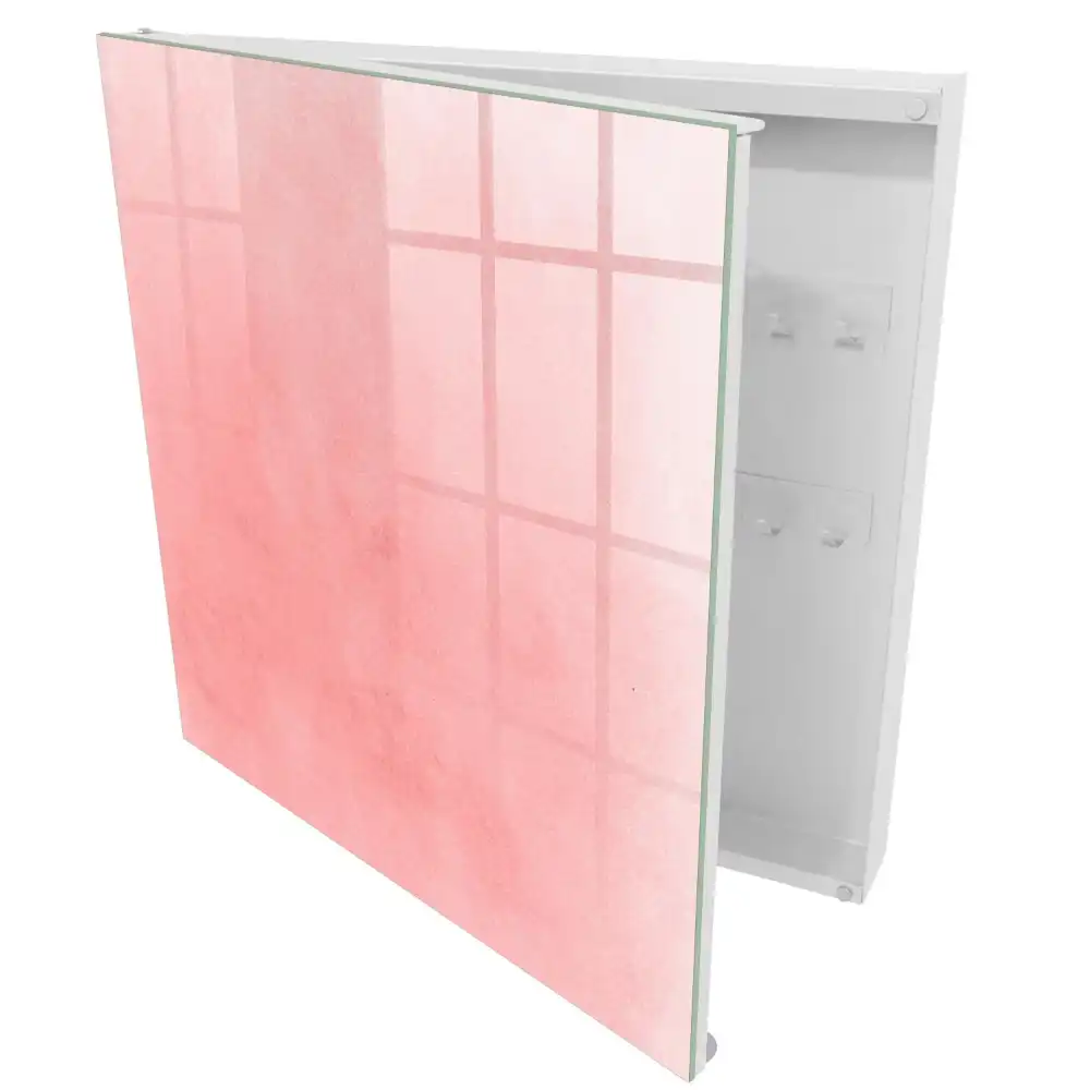 Boîte à clés murale fond rose délicat avec un motif subtil