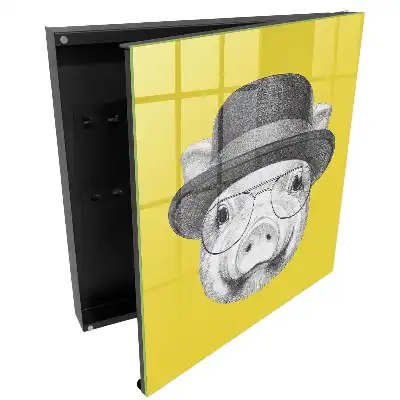 Boîte à clés un cochon avec un chapeau sur fond jaune