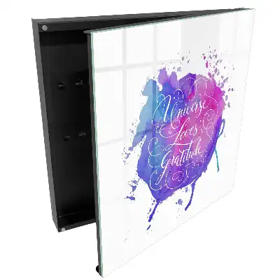 Boîte à clés aquarelle avec une inscription en violet et rose