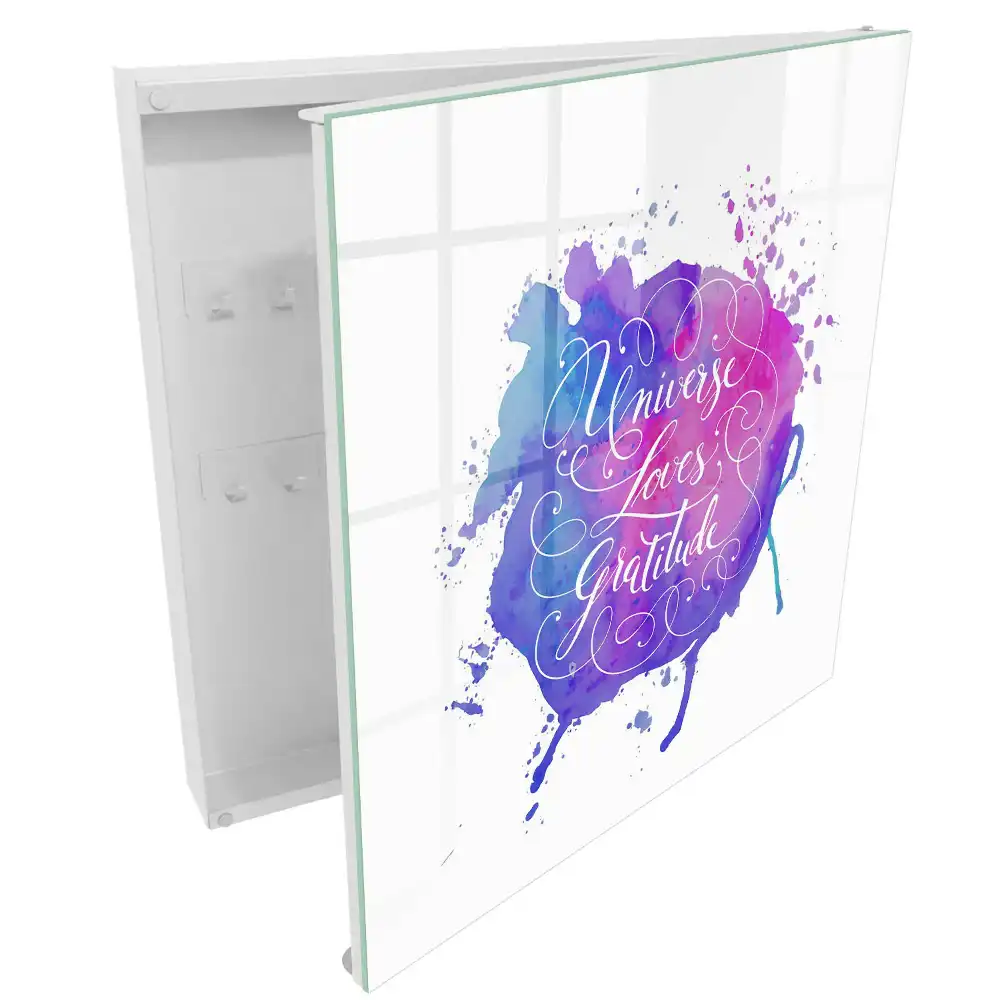 Boîte à clés aquarelle avec une inscription en violet et rose