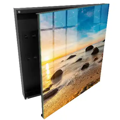 Boîte à clés murale coucher de soleil sur la mer avec des pierres