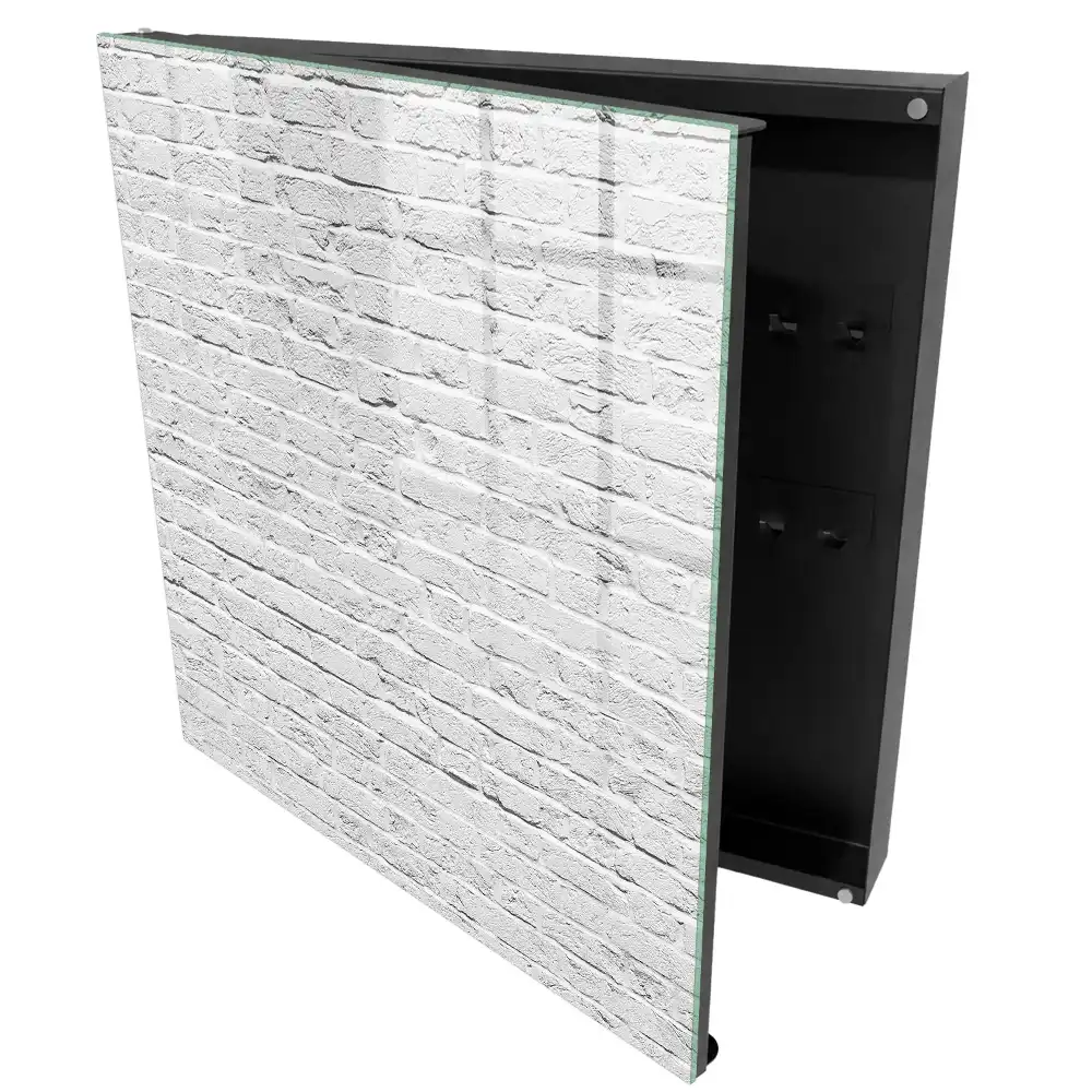 Boîte à clés mur de briques blanches à la texture brute