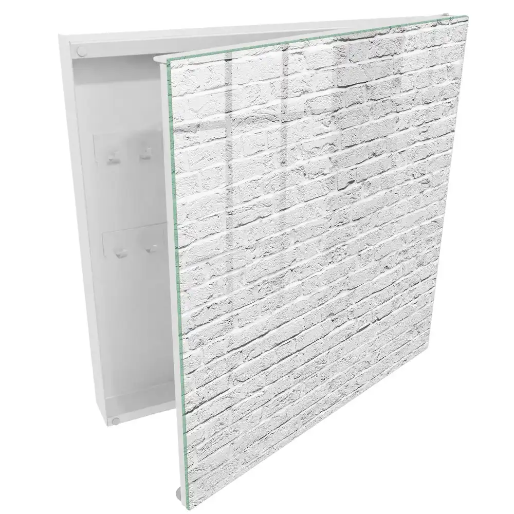 Boîte à clés mur de briques blanches à la texture brute