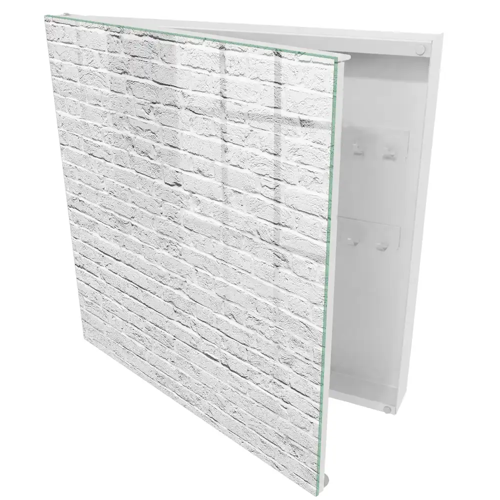 Boîte à clés mur de briques blanches à la texture brute