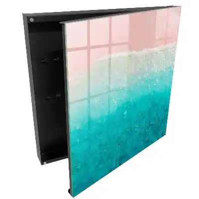 Armoire à clés rivage aux teintes pastel sable rose et mer turquoise