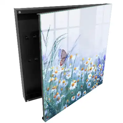 Boîte à clés murale des fleurs et un papillon sur fond de prairie