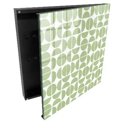 Armoire à clés motifs géométriques verts sur fond blanc