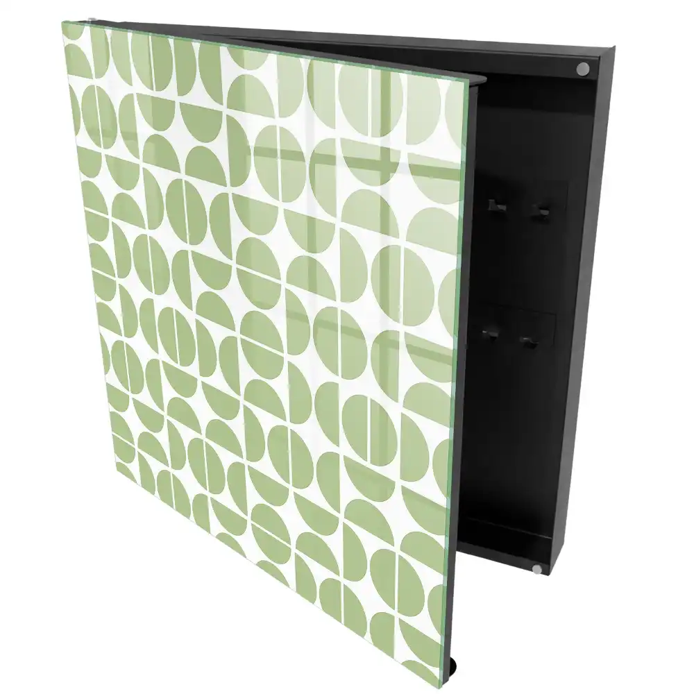 Armoire à clés motifs géométriques verts sur fond blanc