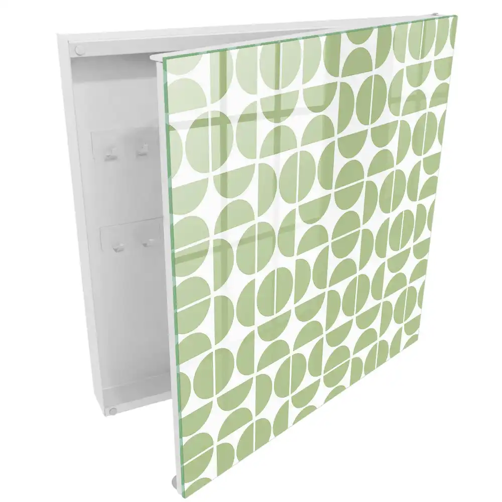 Armoire à clés motifs géométriques verts sur fond blanc