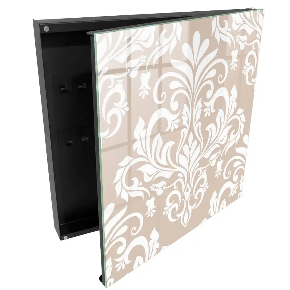 Armoire à clés fond beige motifs symétriques blancs élégants