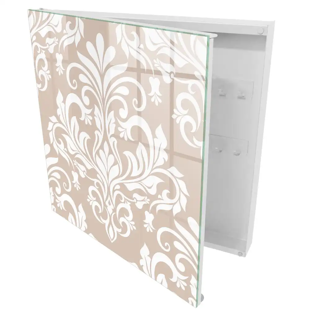 Armoire à clés fond beige motifs symétriques blancs élégants