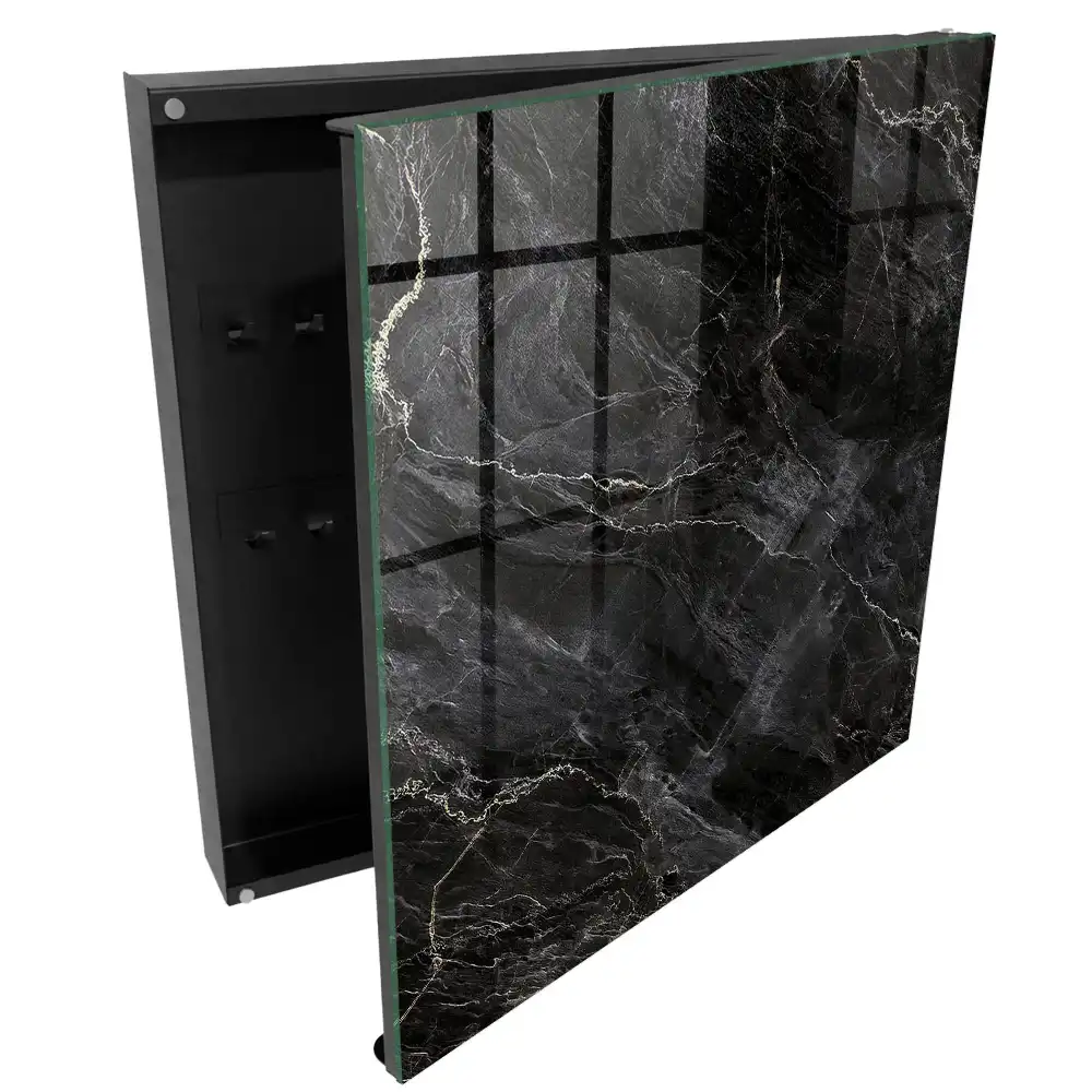 Armoire à clés surface noire veinée de blanc évoquant le marbre