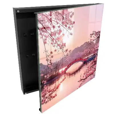 Armoire à clés pont rouge avec des cerises roses et du soleil