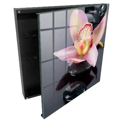 Boîte à clés murale orchidée sur pierres noires