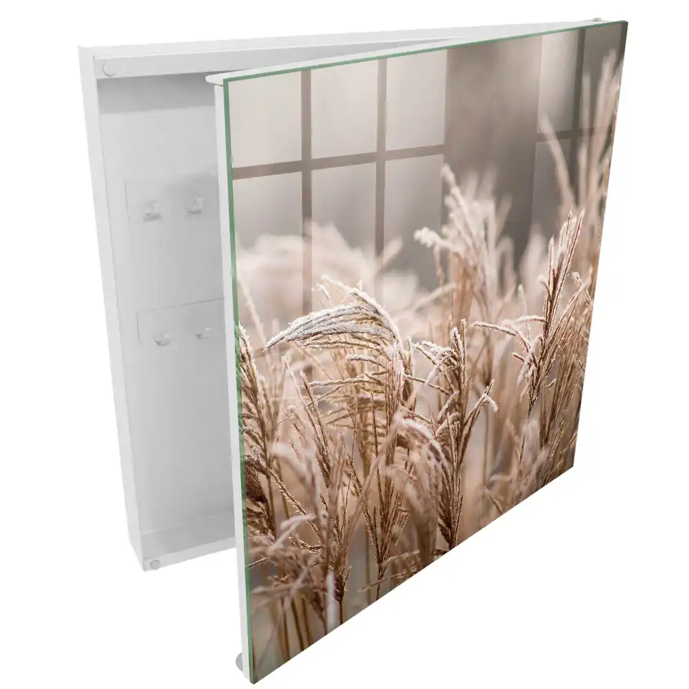 Armoire à clés des herbes délicates couvertes de givre dans des teintes chaudes