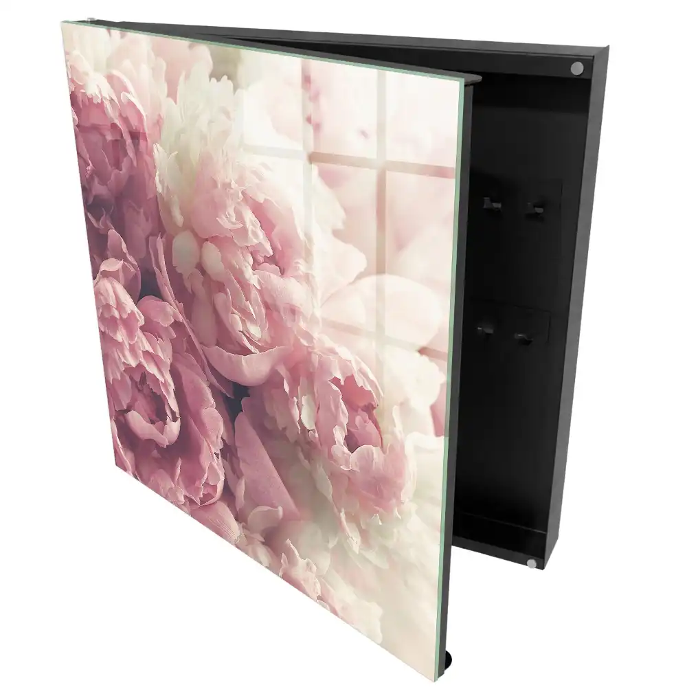 Boîte à clés murale des fleurs subtiles dans des tons de rose et de crème